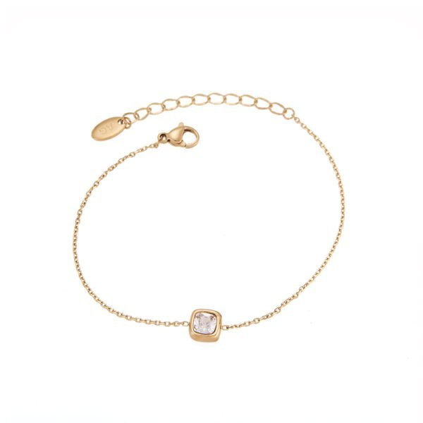 Bracelet or rose avec pierre brillante, bijou élégant et moderne, idéal pour compléter une tenue chic.