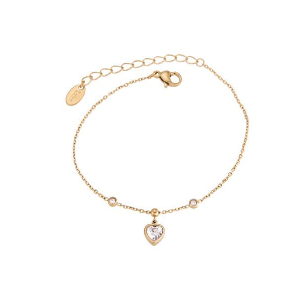 Bracelet or avec cœur en cristal et détails nacrés, bijou tendance et élégant.