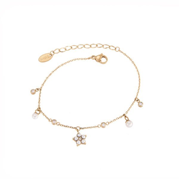 Bracelet fin or doré avec perles de perle et cristaux scintillants, élégance et féminité.