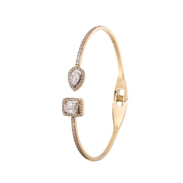 Bracelet doré avec cristaux Swarovski, design élégant et sophistiqué.