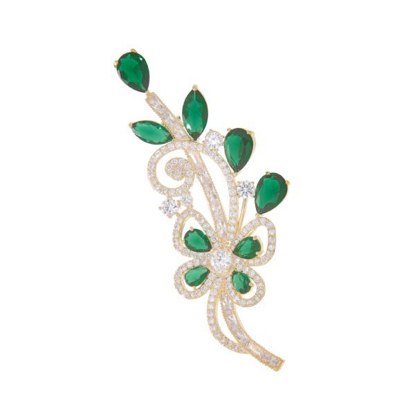Épingle à bijoux or avec rubis vert et diamants, design floral élégant.