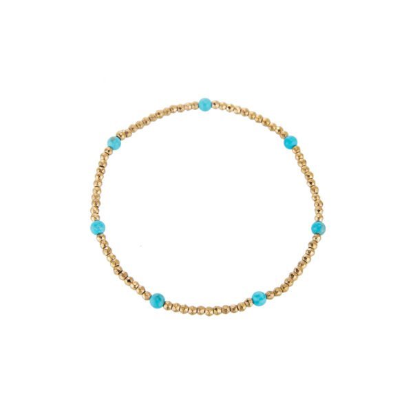 Bracelet chic en perles turquoise et dorées, parfait pour un style élégant et tendance.